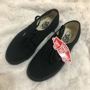 Black Vans sneakers